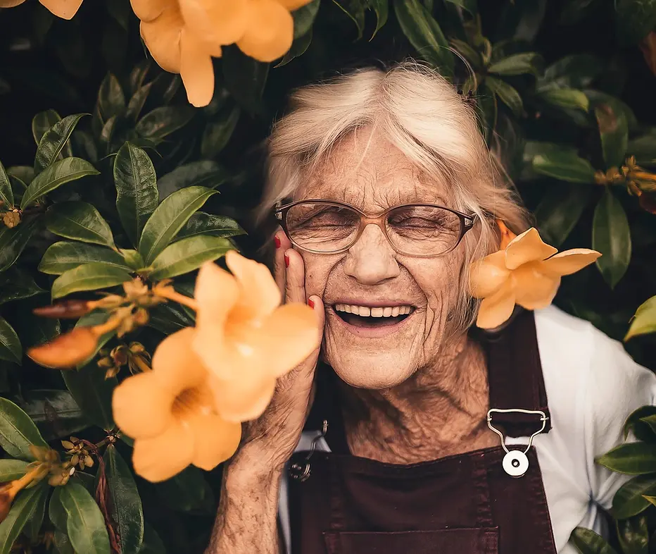 woman-standing-near-yellow-petaled-flower-2050994